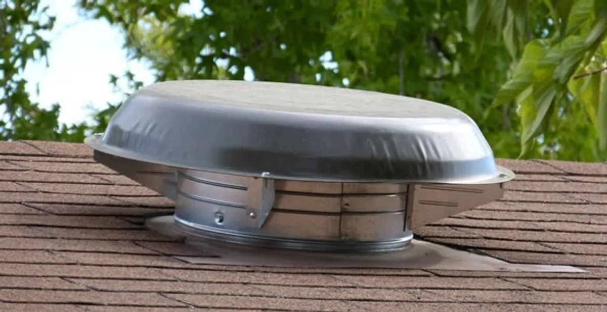attic fan installation services with low-profile roof ventilation unit in Overland Park, KS