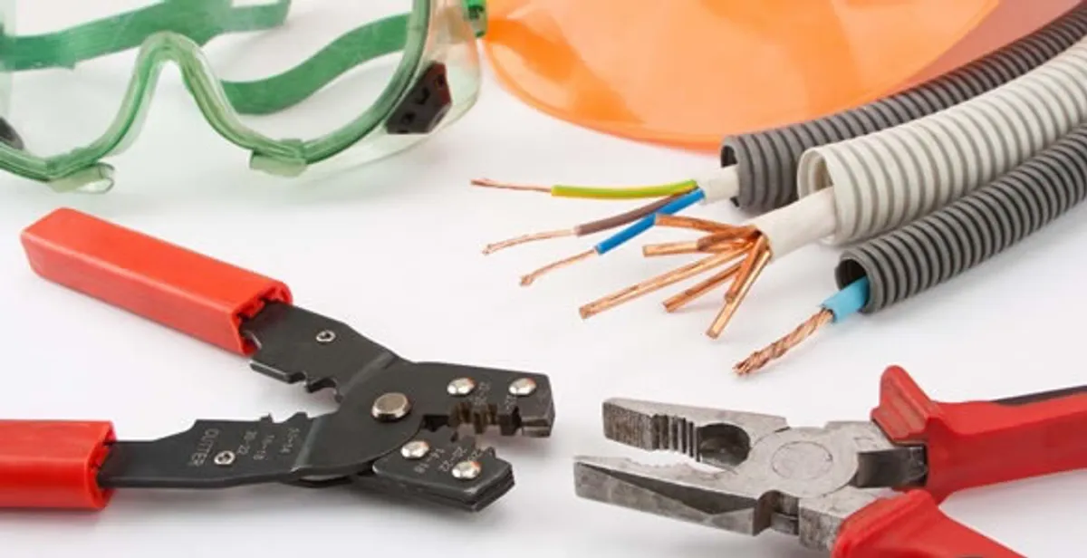 Electrical wiring repair with professional tools and safety equipment in Shawnee Mission, KS