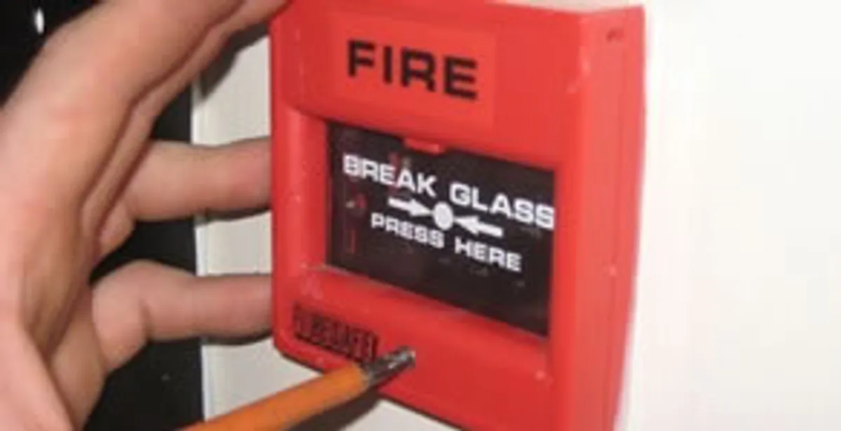 fire alarm installation service showing manual fire alarm pull station installed by licensed electricians in Overland Park, KS